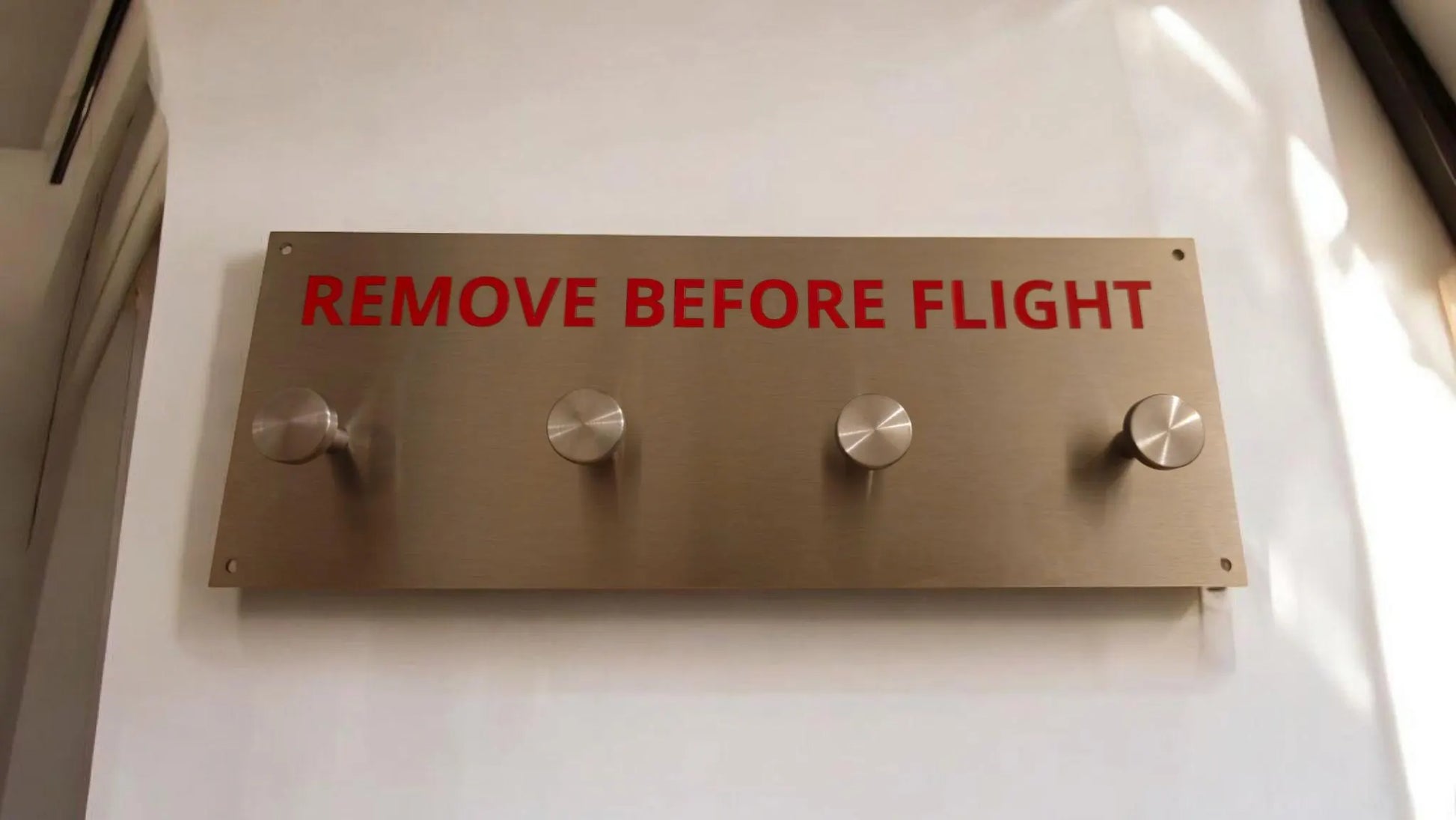 Remove before flight hanger