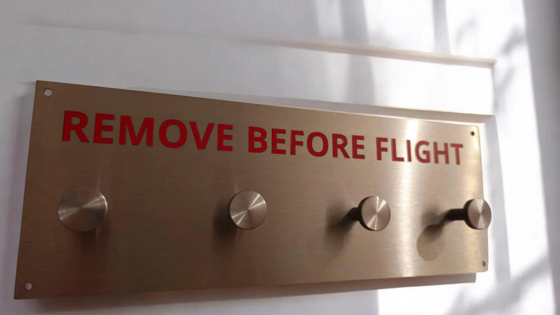 Remove before flight hanger